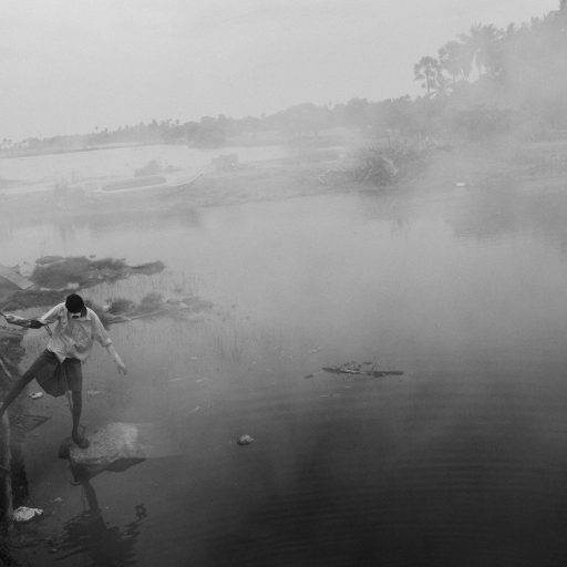 A young man seen searching for the dead near the fishing village of Mullaittivu, Sri Lanka, Jan. 5, 2005. The village was one of the most devastated areas of Sri Lanka, with more than 2000 people are believed to have died in this town alone.
