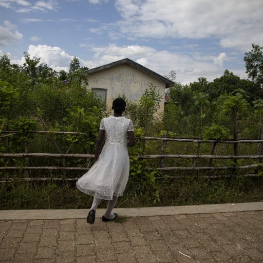 Savane Diane, Haiti, October 24, 2021. A young villager returning from Sunday mass in the Savane Diane project housing village. © Adriana Zehbrauskas.